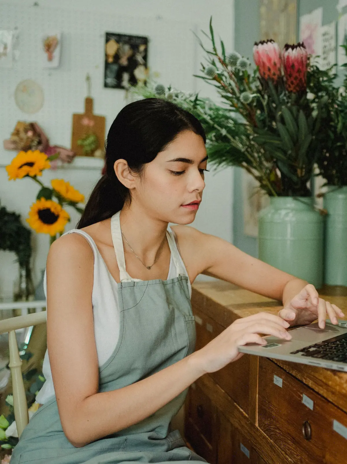 Business owner checking her business credit report on a laptop