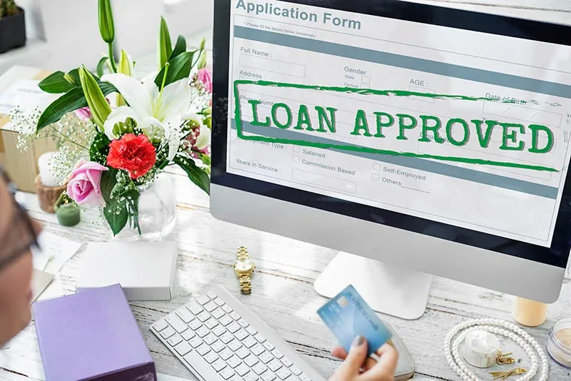 Business owner preparing bank statements and financials for an unsecured loan application